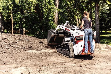 using a skid steer for hay making|bobcat skid steer.